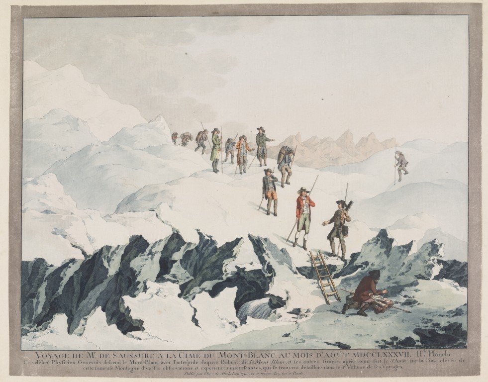 View of expedition in snowy mountain landscape with ladder in foreground.