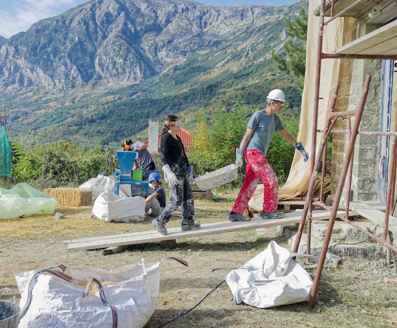 building work underway with mountains behind